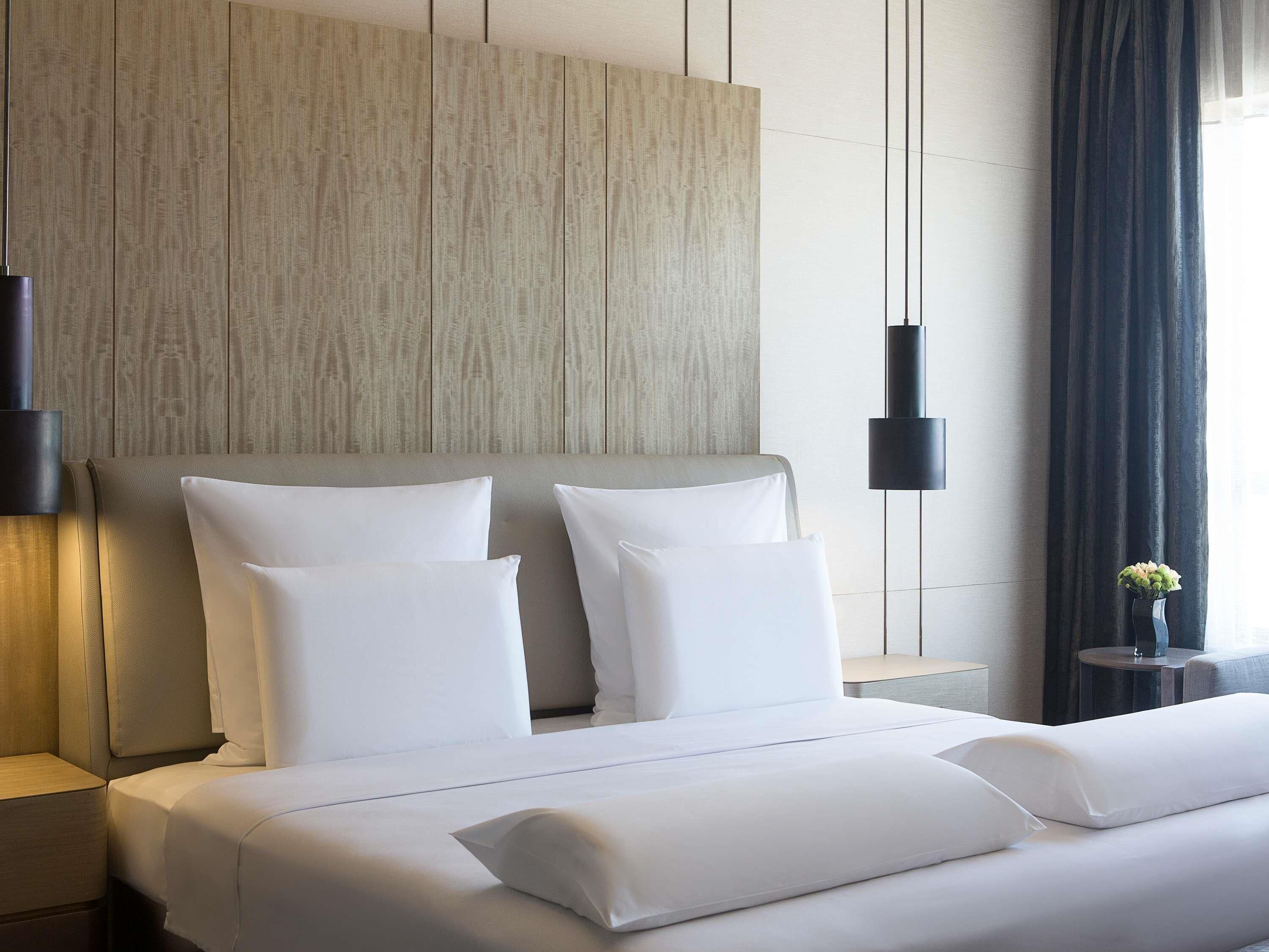 Premium bedding, down comforters, minibar, in-room safe