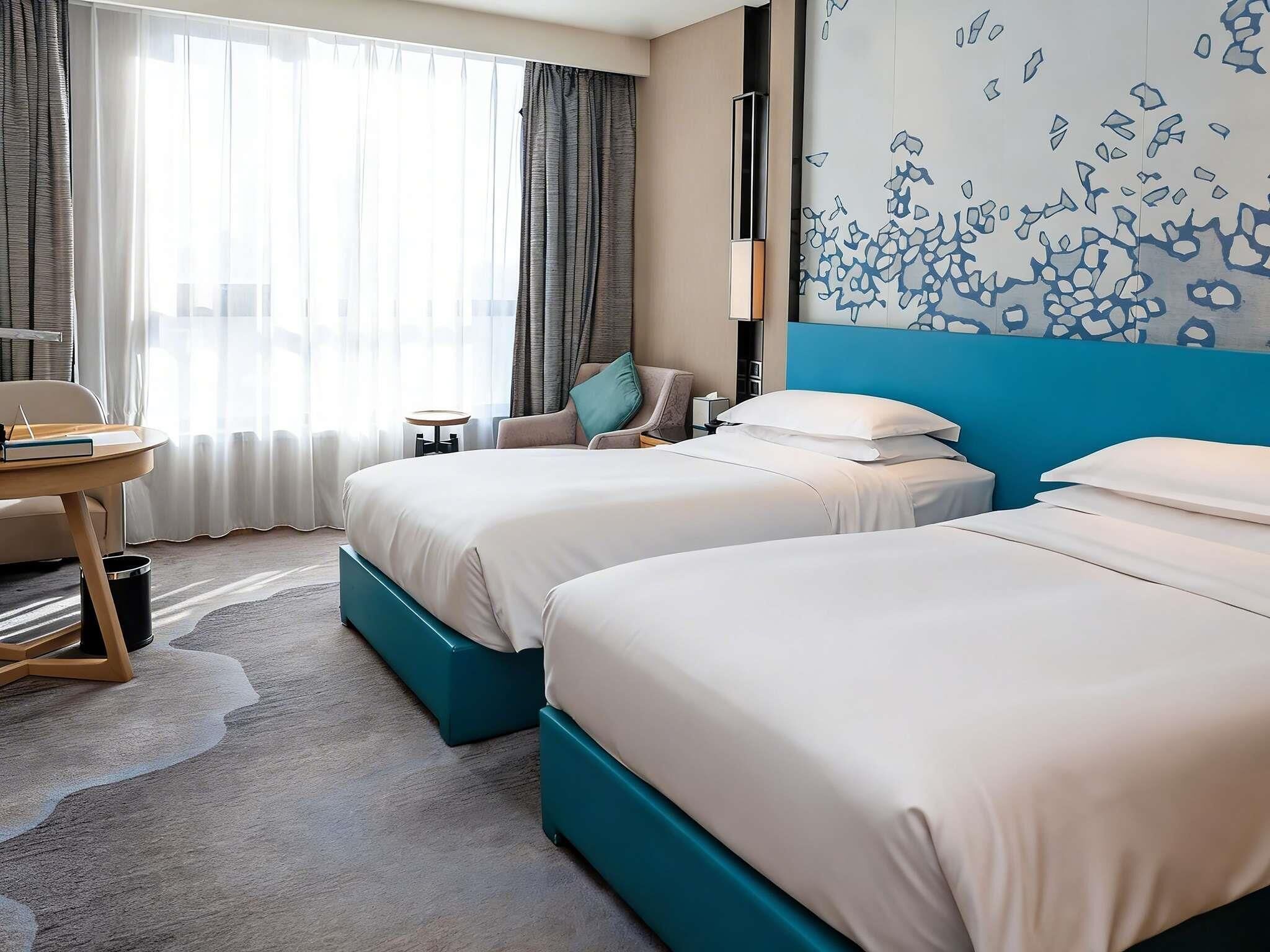 Deluxe Room, 2 Twin Beds | Premium bedding, down comforters, minibar, in-room safe