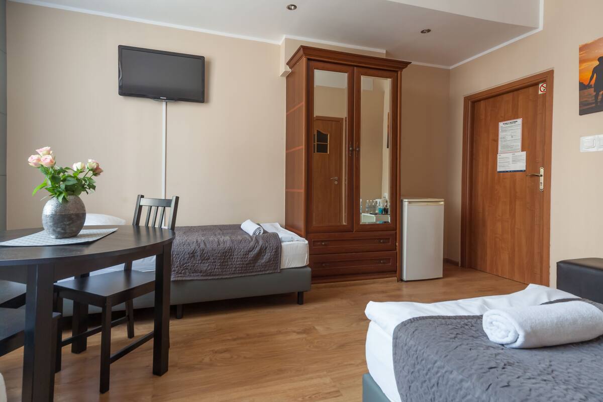 Triple Room, Ground Floor (002 Street View) | Down comforters, iron/ironing board (on request), WiFi (free)