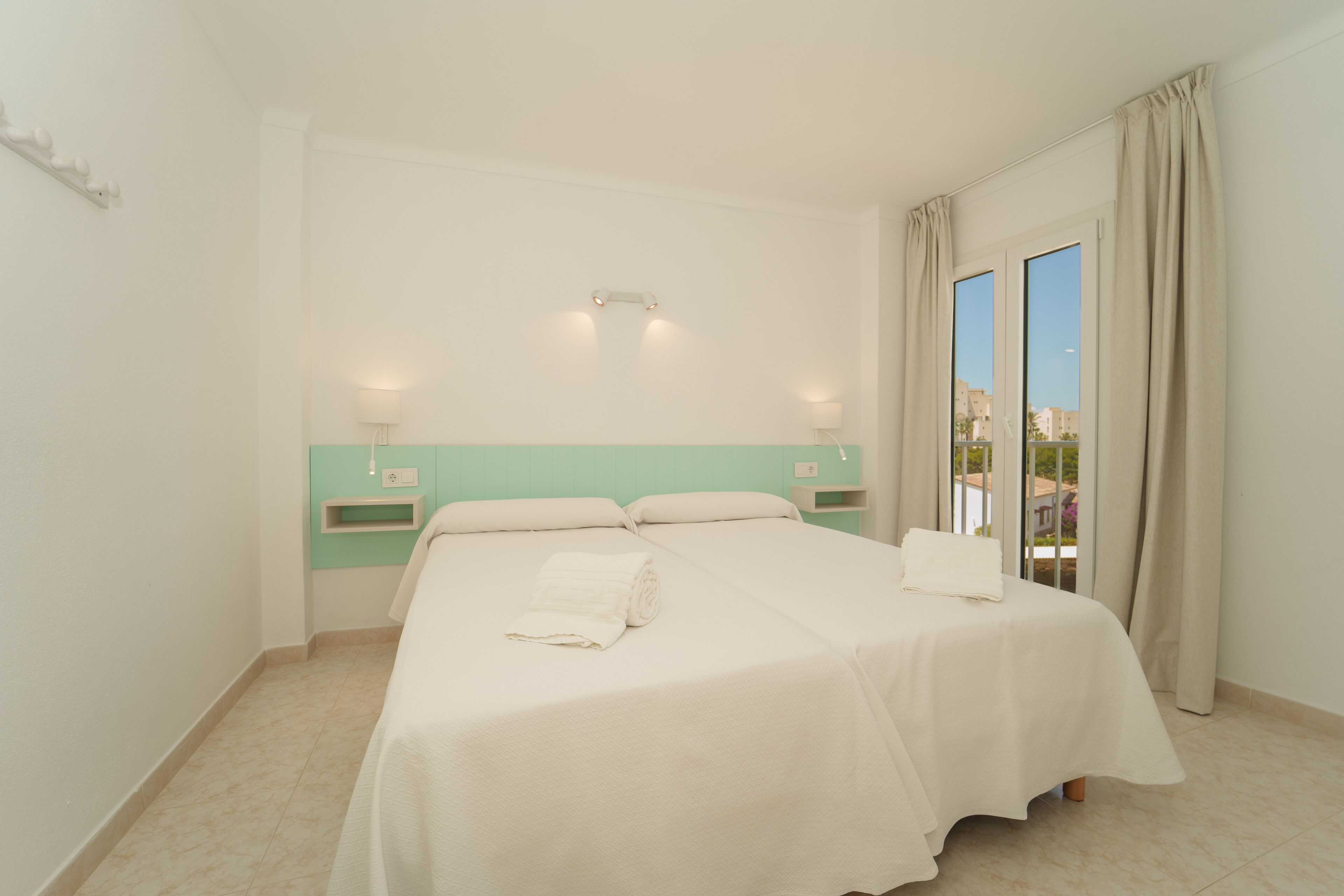 apartment, 1 bedroom, balcony, sea view | 1 bedroom, desk, blackout curtains, iron/ironing board