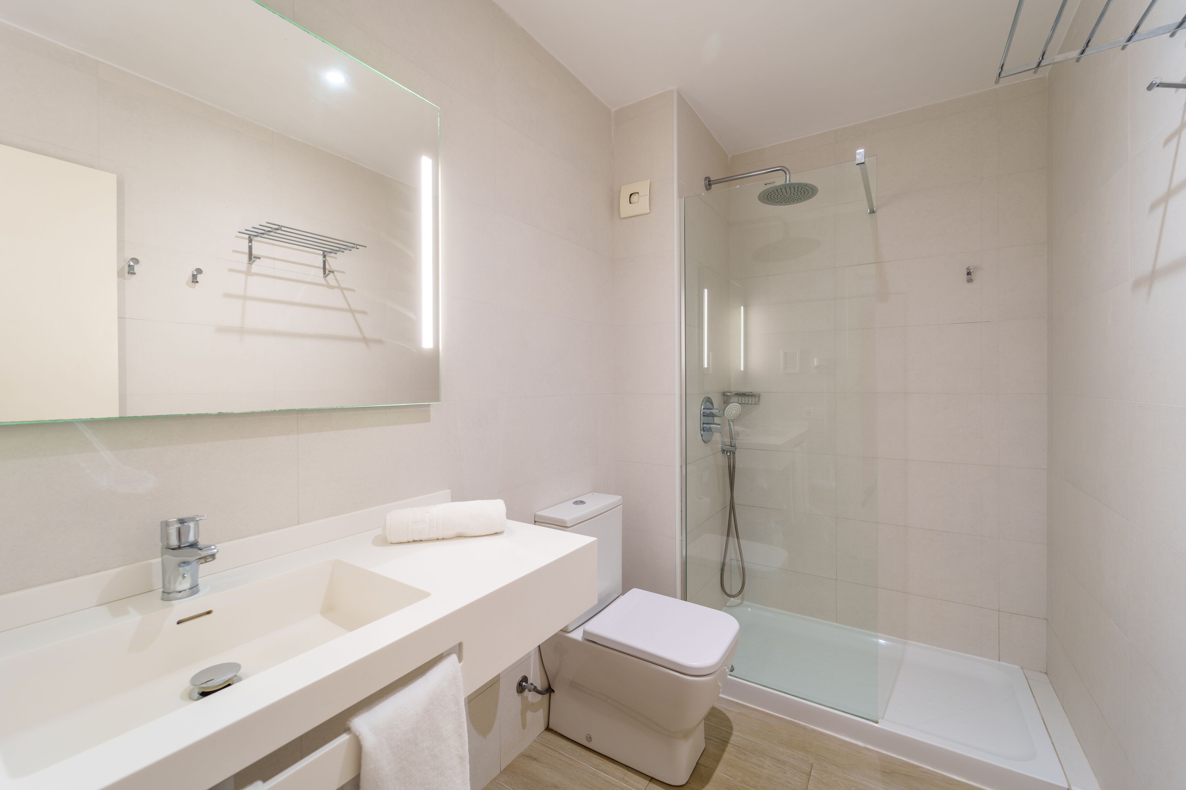 shower, hair dryer, towels, shampoo