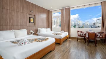 Deluxe Triple Room, City View | Tempur-Pedic beds, minibar, laptop workspace, blackout drapes