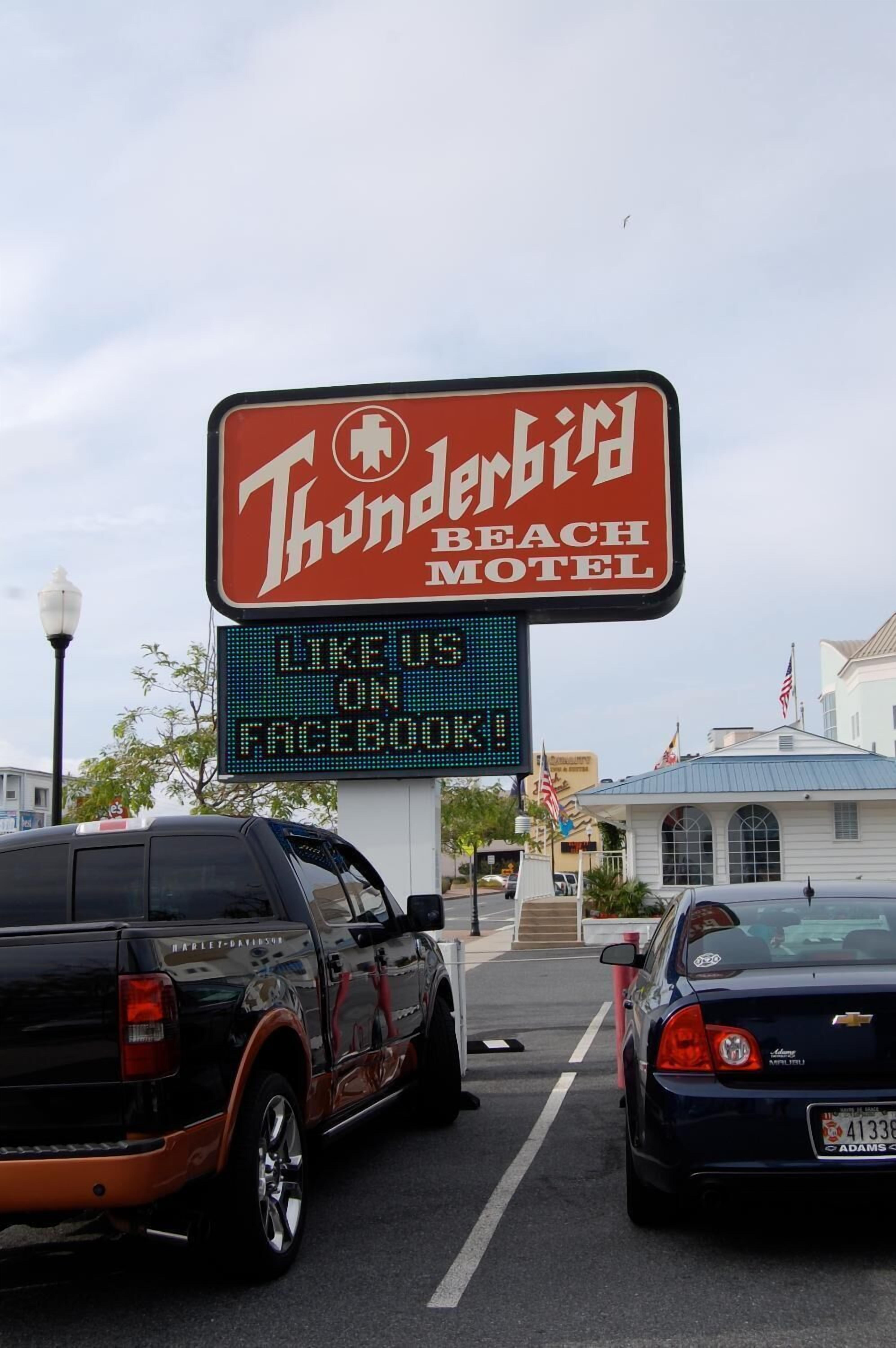 A motel sign with a digital display below it.