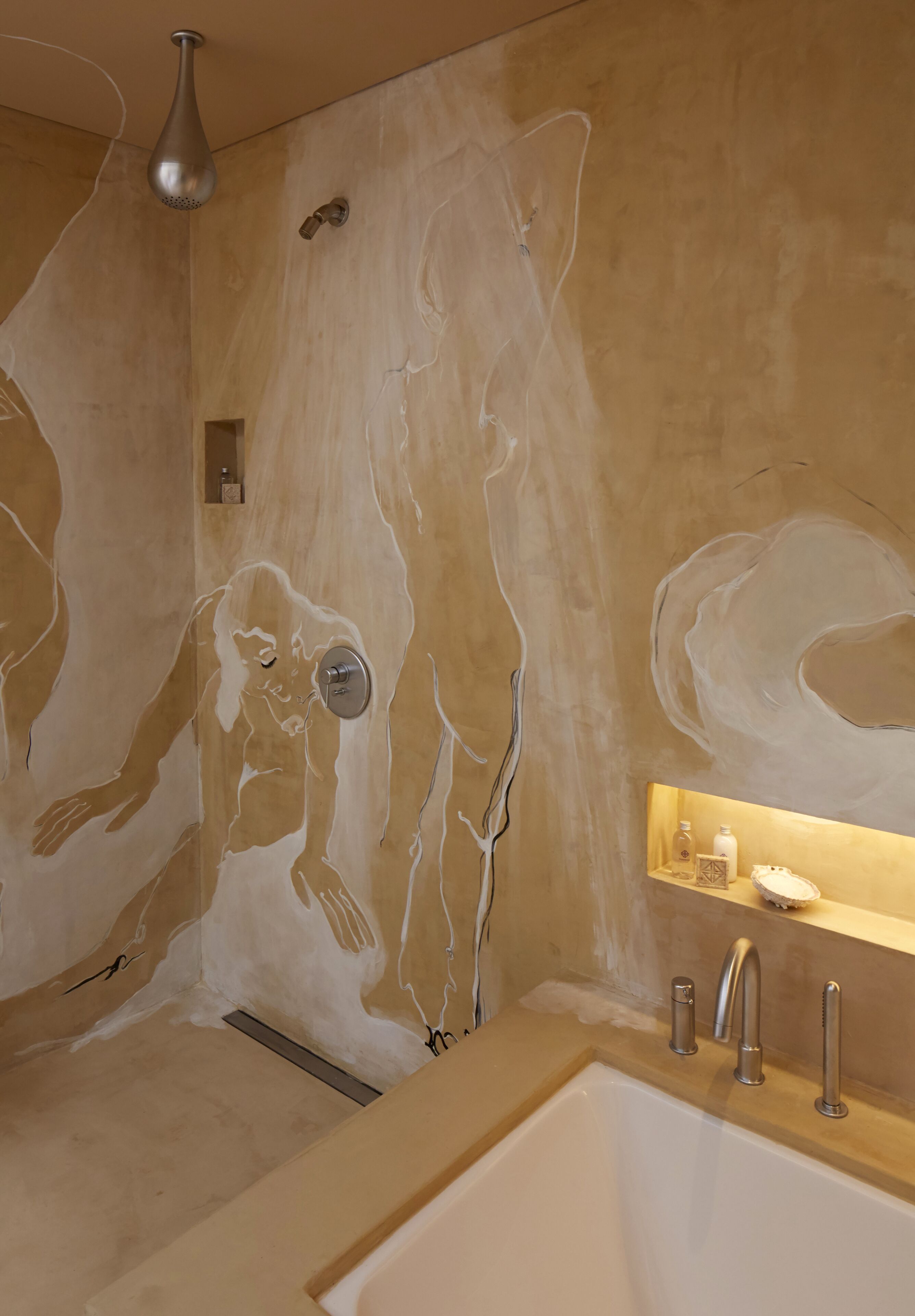 A bathroom with a large bathtub, a shower, and a wall with a unique abstract mural.