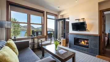 Deluxe Apartment, 2 Bedrooms | Living area | 32-inch flat-screen TV with satellite channels, TV, fireplace