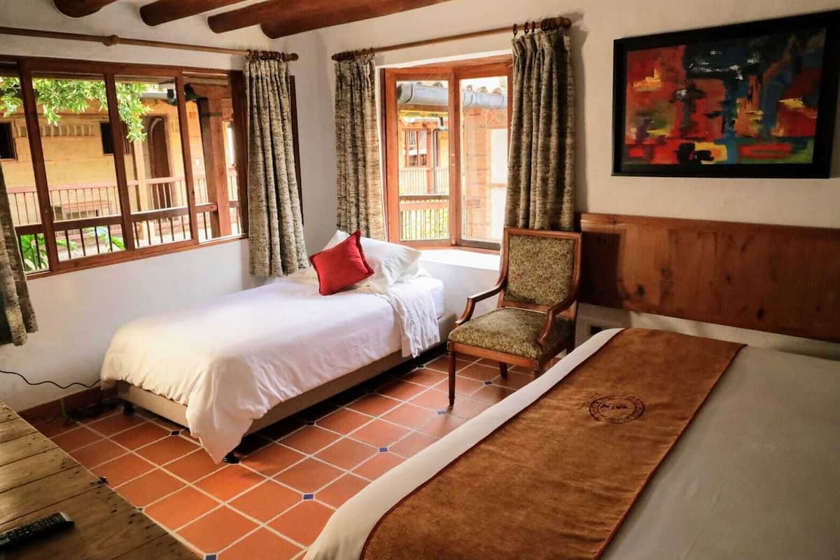 triple room, multiple beds | 1 bedroom, premium bedding, desk, laptop workspace