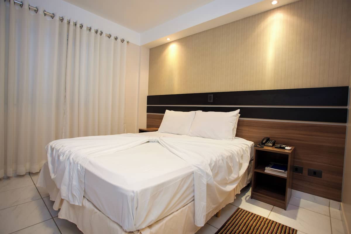 Premium bedding, laptop workspace, blackout curtains, free WiFi