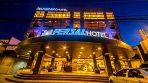 A hotel with a prominent sign reading "FERSAL HOTEL" and a curved entrance with steps leading up to it. - Fersal Hotel Puerto Princesa (Puerto Princesa)