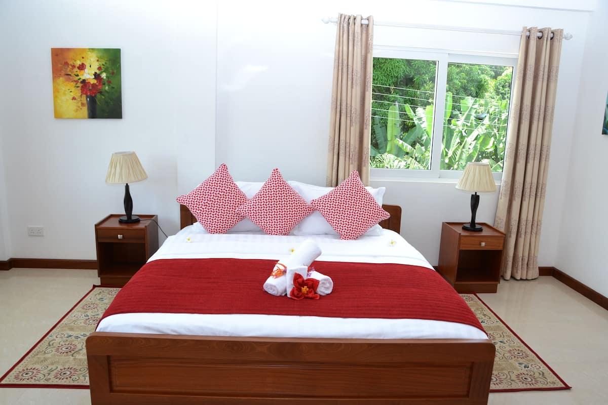Family Apartment | 1 bedroom, in-room safe, blackout curtains, iron/ironing board
