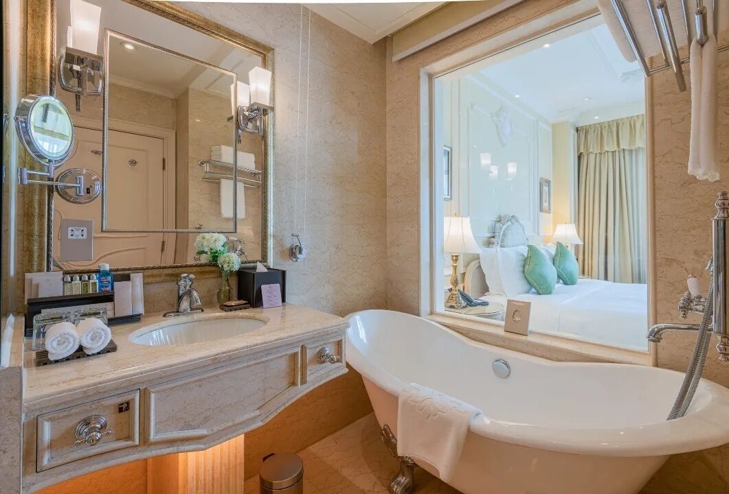 deluxe suite, garden view | bathroom | separate bathtub and shower, rainfall showerhead