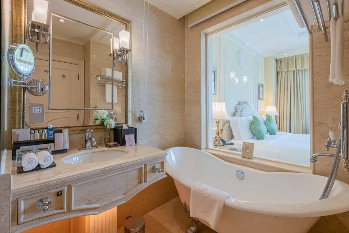 deluxe suite, garden view | bathroom | separate bathtub and shower, rainfall showerhead
