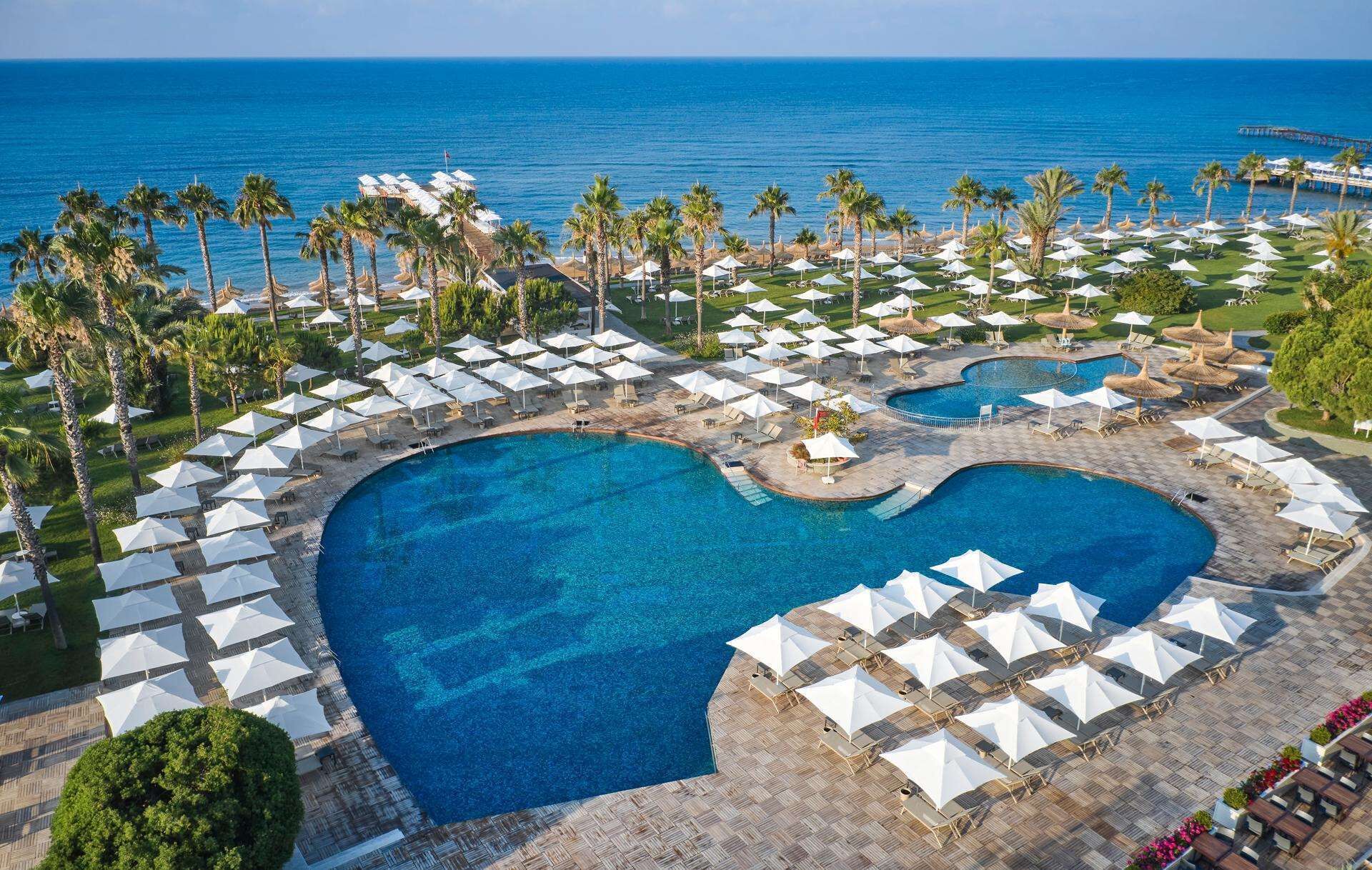 indoor pool, 7 outdoor pools, open 7:00 am to 7:00 pm, pool umbrellas