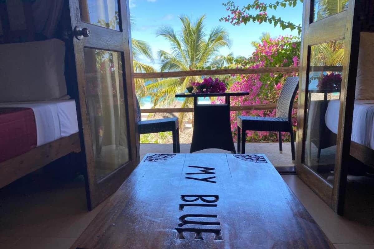 Quadruple Room, Ocean View | Free minibar items, in-room safe, desk, laptop workspace