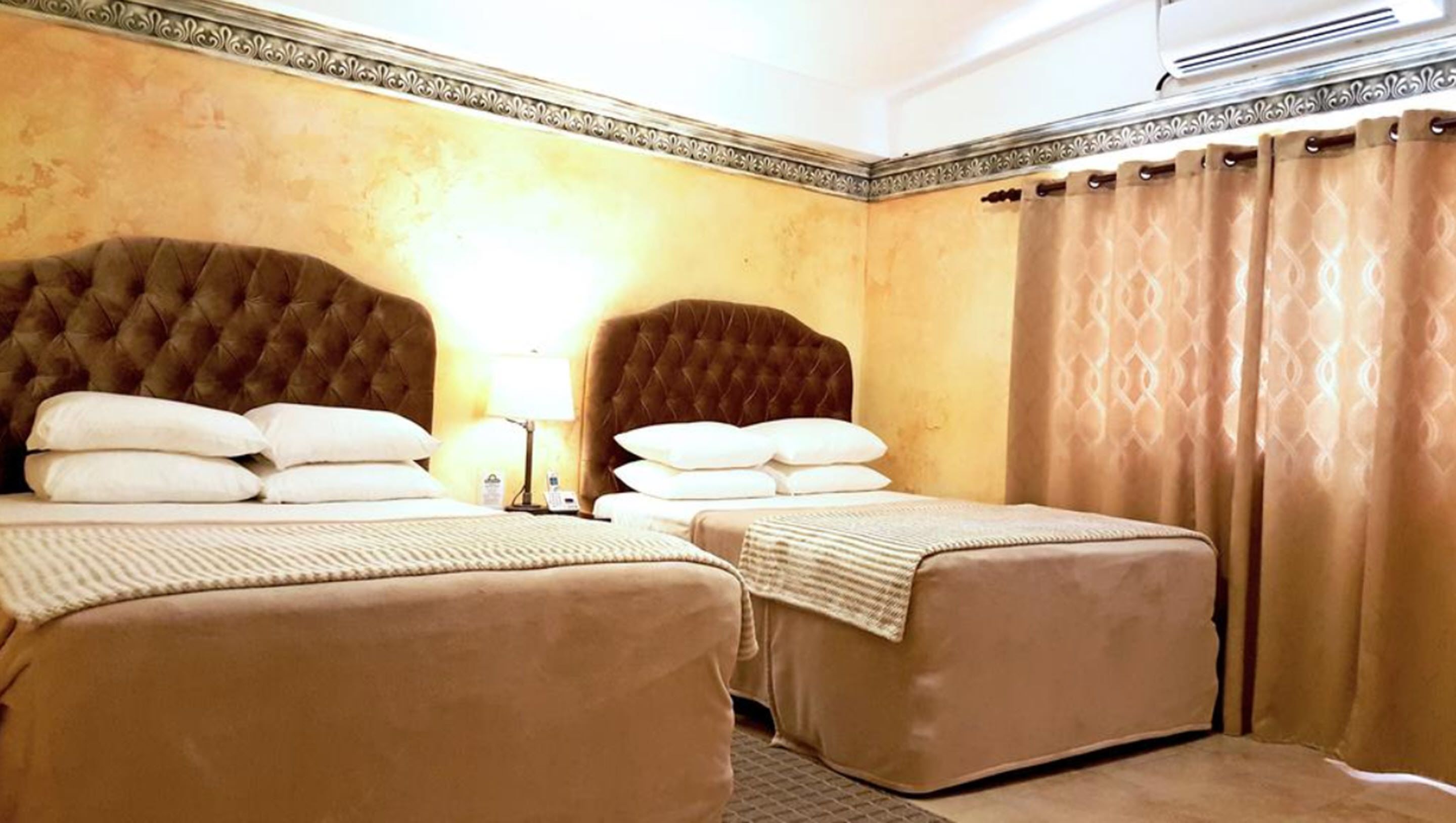 Room, 2 Queen Beds, Non Smoking | In-room safe, desk, iron/ironing board, free cribs/infant beds