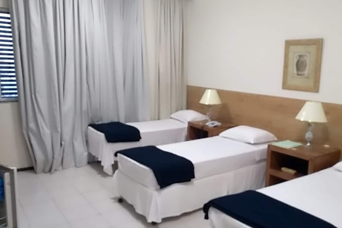 Standard Triple Room | Minibar, in-room safe, desk, soundproofing