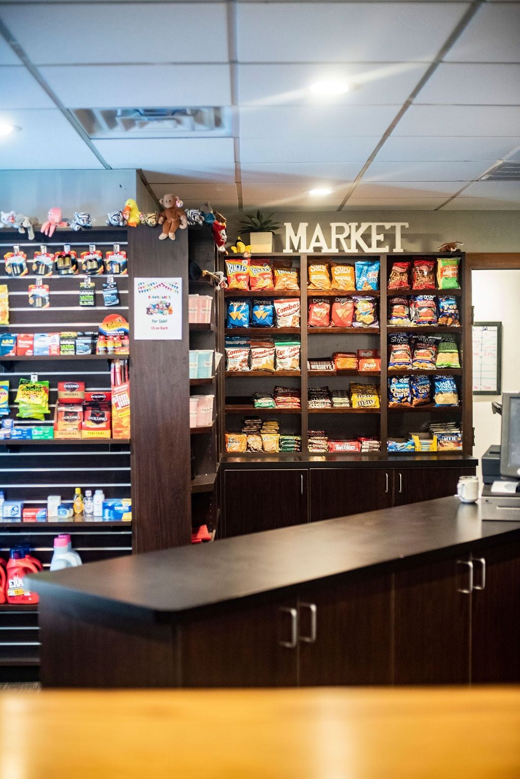 A snack display in a store with a 'MARKET' sign above.