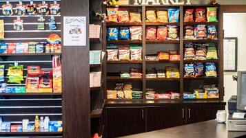 A snack display in a store with a 'MARKET' sign above.
