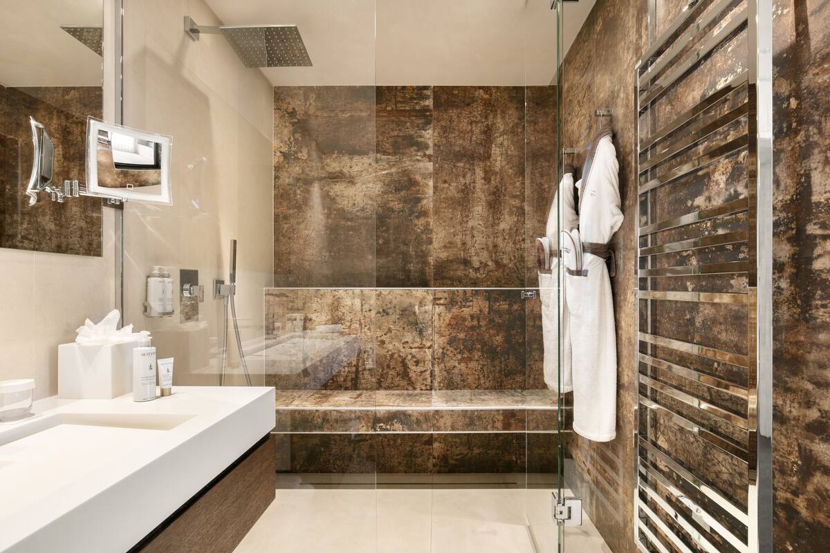 pool suite | bathroom | designer toiletries, hair dryer, bathrobes, towels