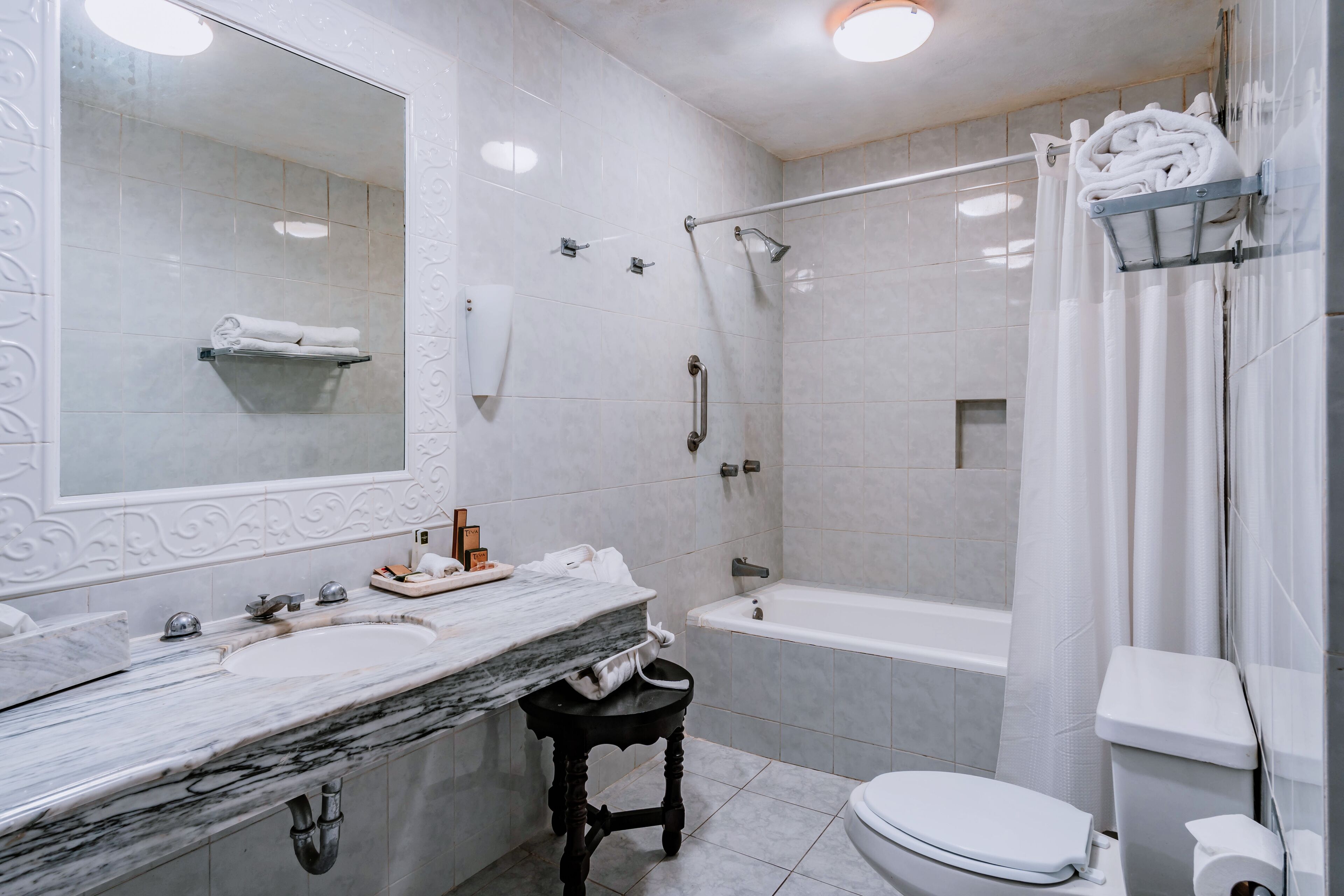 designer toiletries, hair dryer, towels, soap