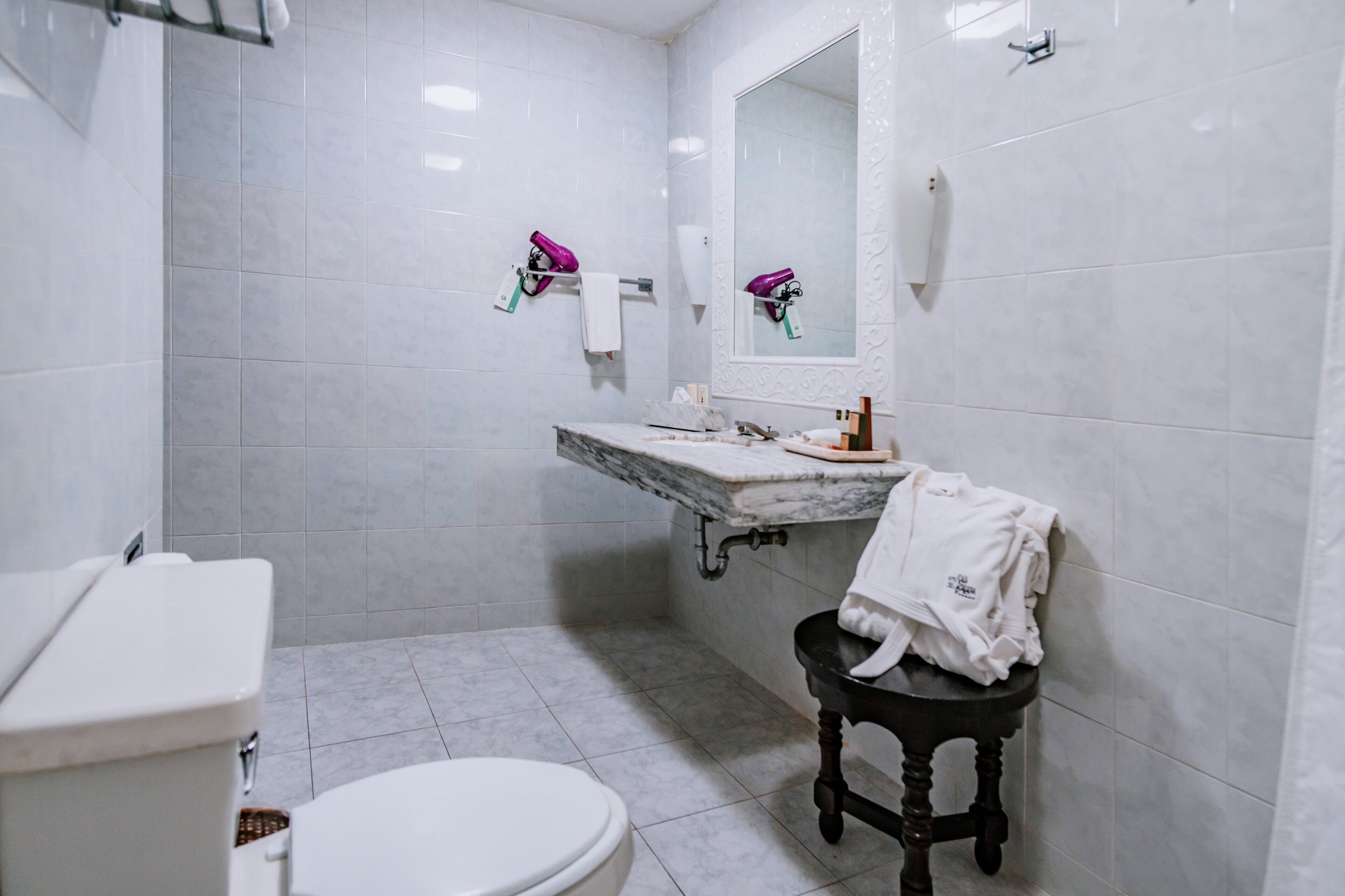 designer toiletries, hair dryer, towels, soap