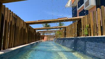 2 outdoor pools, open 7:00 AM to 10:00 PM, pool umbrellas, pool loungers