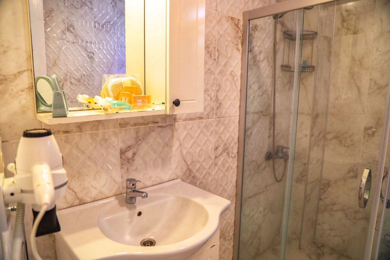 deluxe double room, balcony | bathroom | shower, free toiletries, hair dryer, slippers
