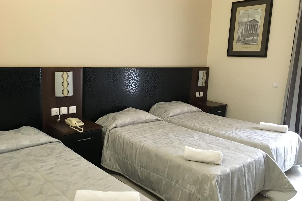 standard triple room | in-room safe, desk, blackout curtains, iron/ironing board