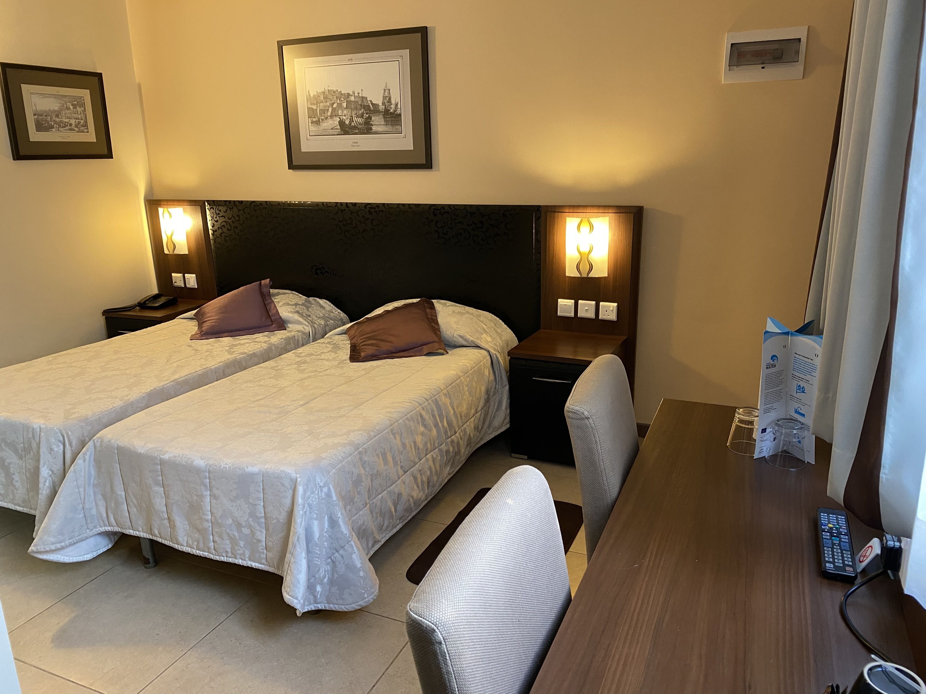 economy room, courtyard view | in-room safe, desk, blackout curtains, iron/ironing board