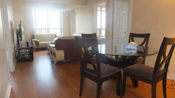 Deluxe Condo, 3 Bedrooms | Living area | Plasma TV
