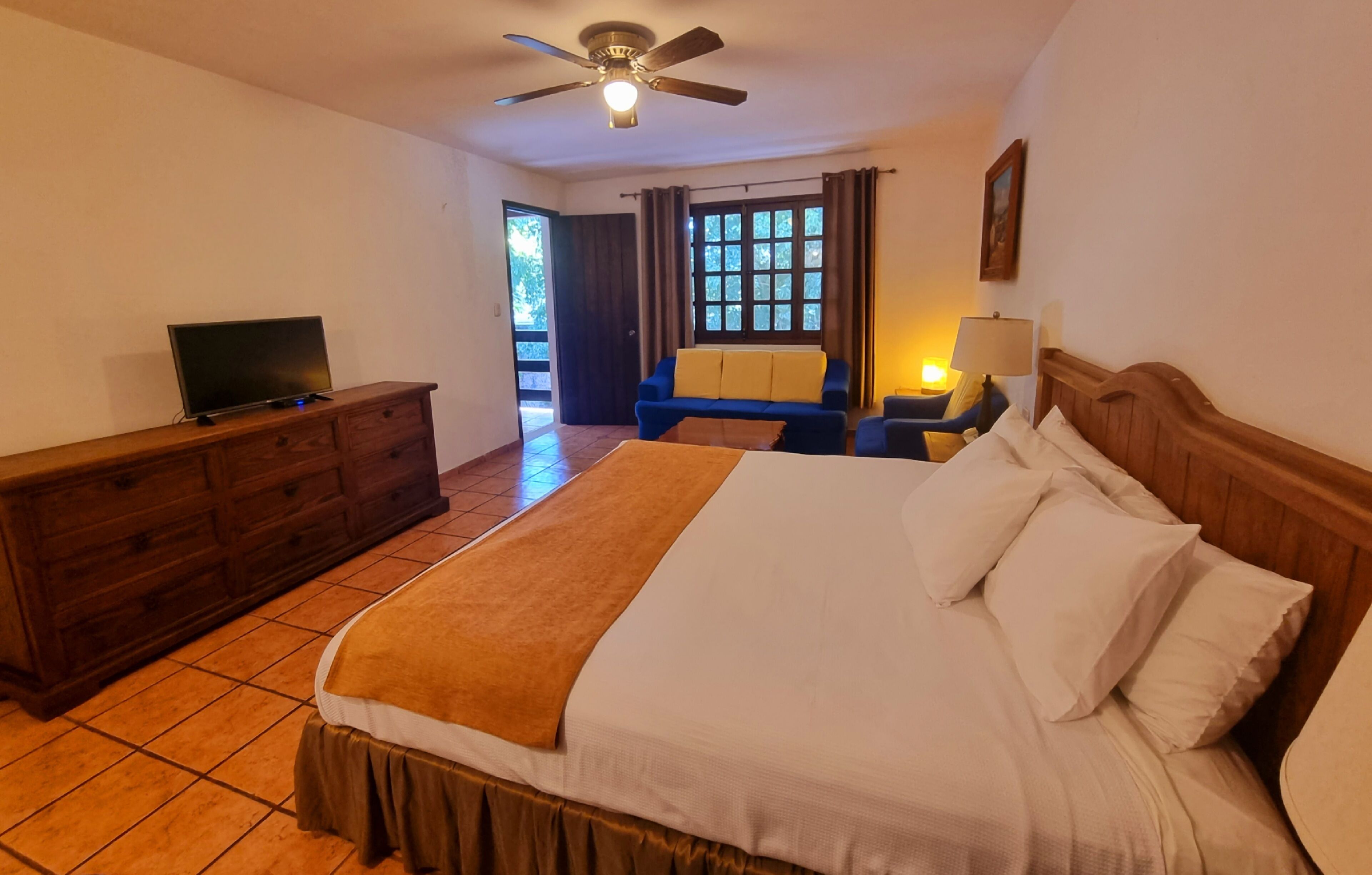 junior studio suite, 1 king bed, refrigerator, garden view | desk, iron/ironing board, free cots/infant beds, free wifi