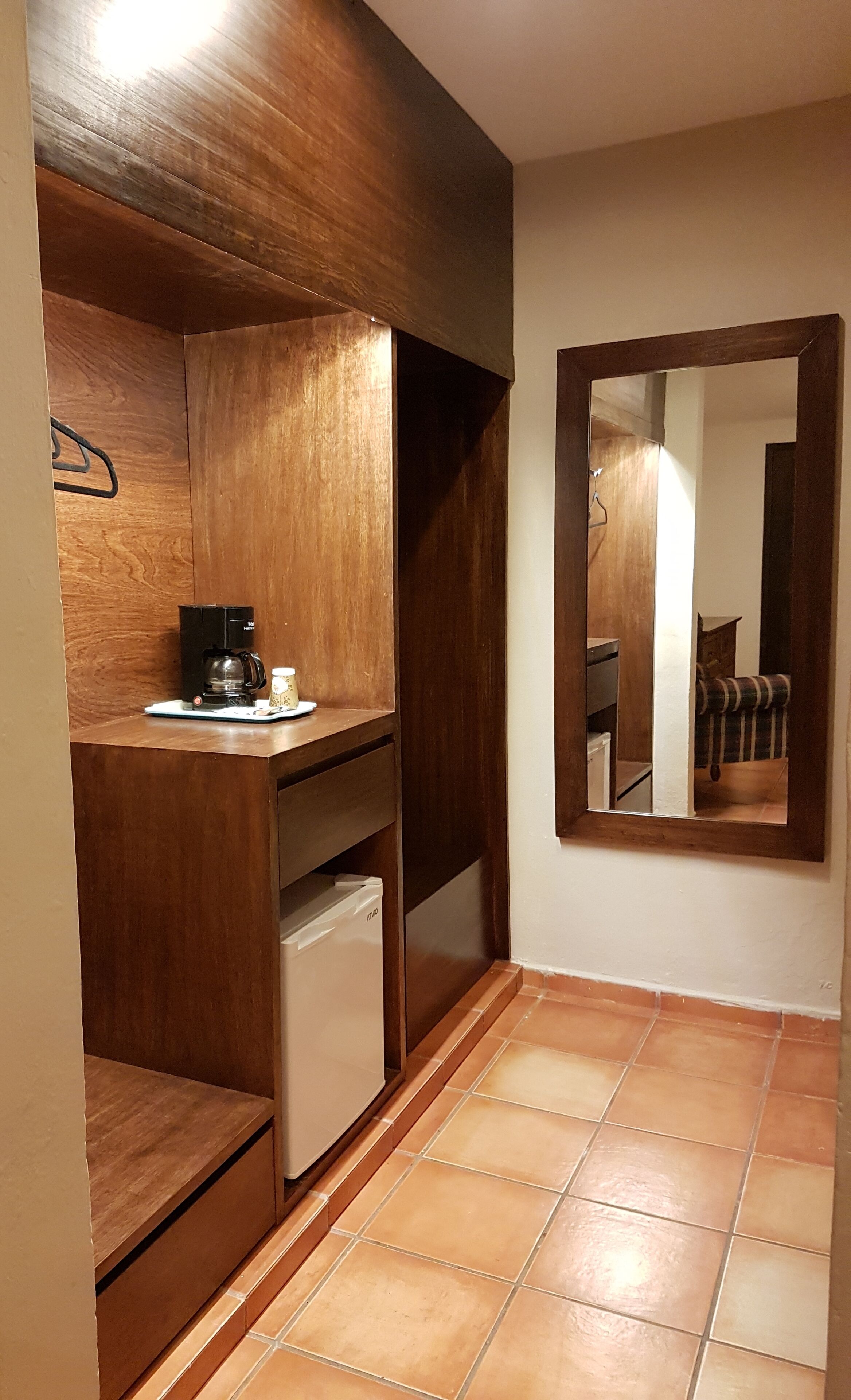 deluxe room, 1 king bed, refrigerator, garden view | room amenity