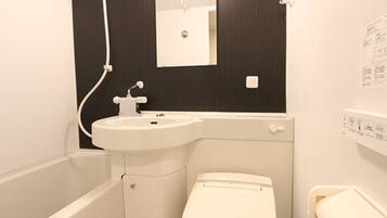 Combined shower/tub, free toiletries, hair dryer, slippers