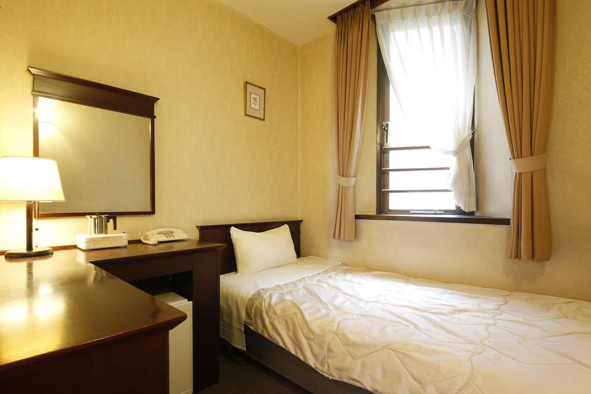 Down duvets, desk, laptop workspace, blackout curtains