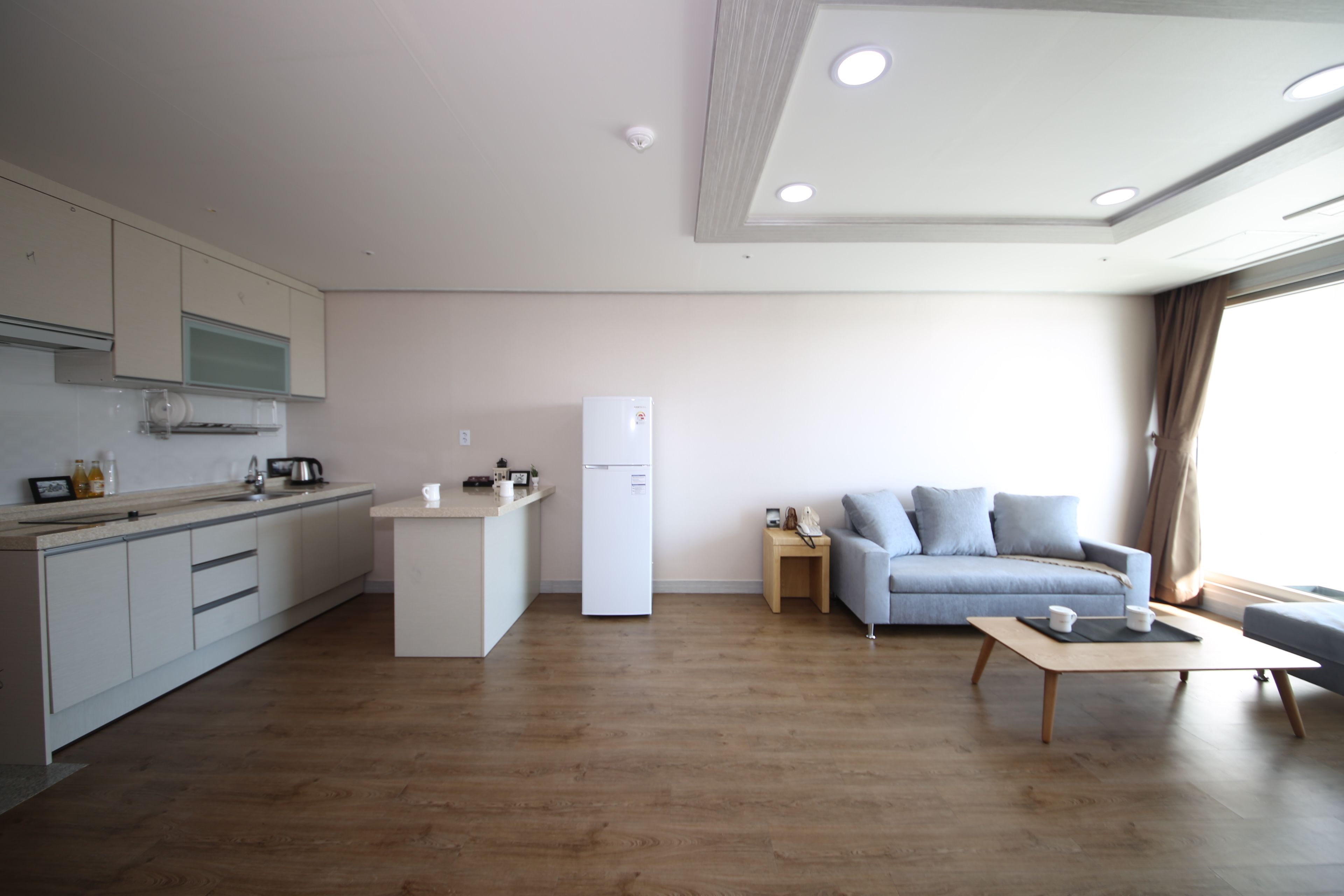 family room, city view | living room | flat-screen tv, pay films, heated floors