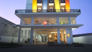 A modern hotel with a multi-story structure, featuring a prominent sign at the top. - Amaris Hotel Malang (Malang)