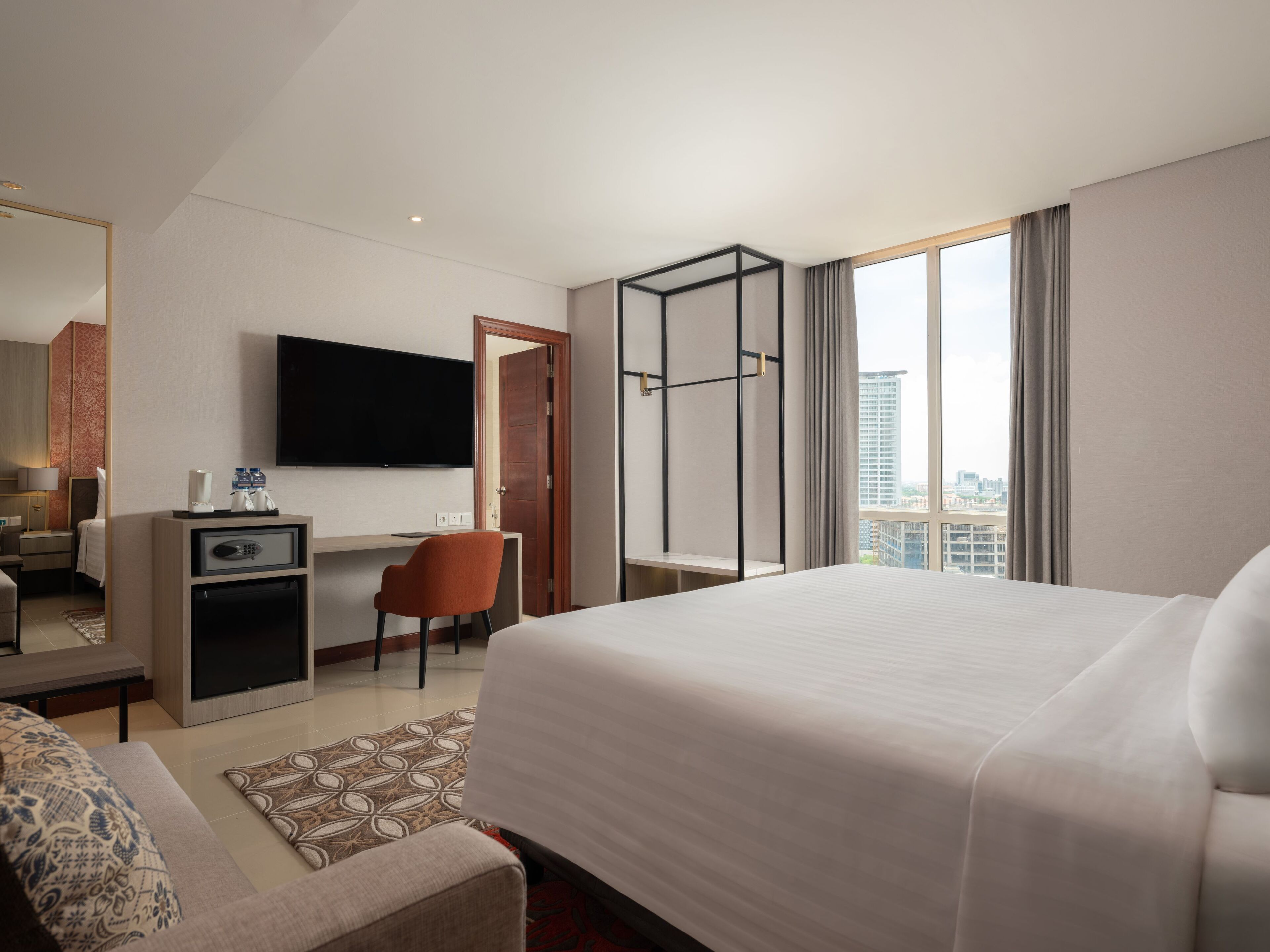 junior suite room | in-room safe, desk, laptop workspace, soundproofing