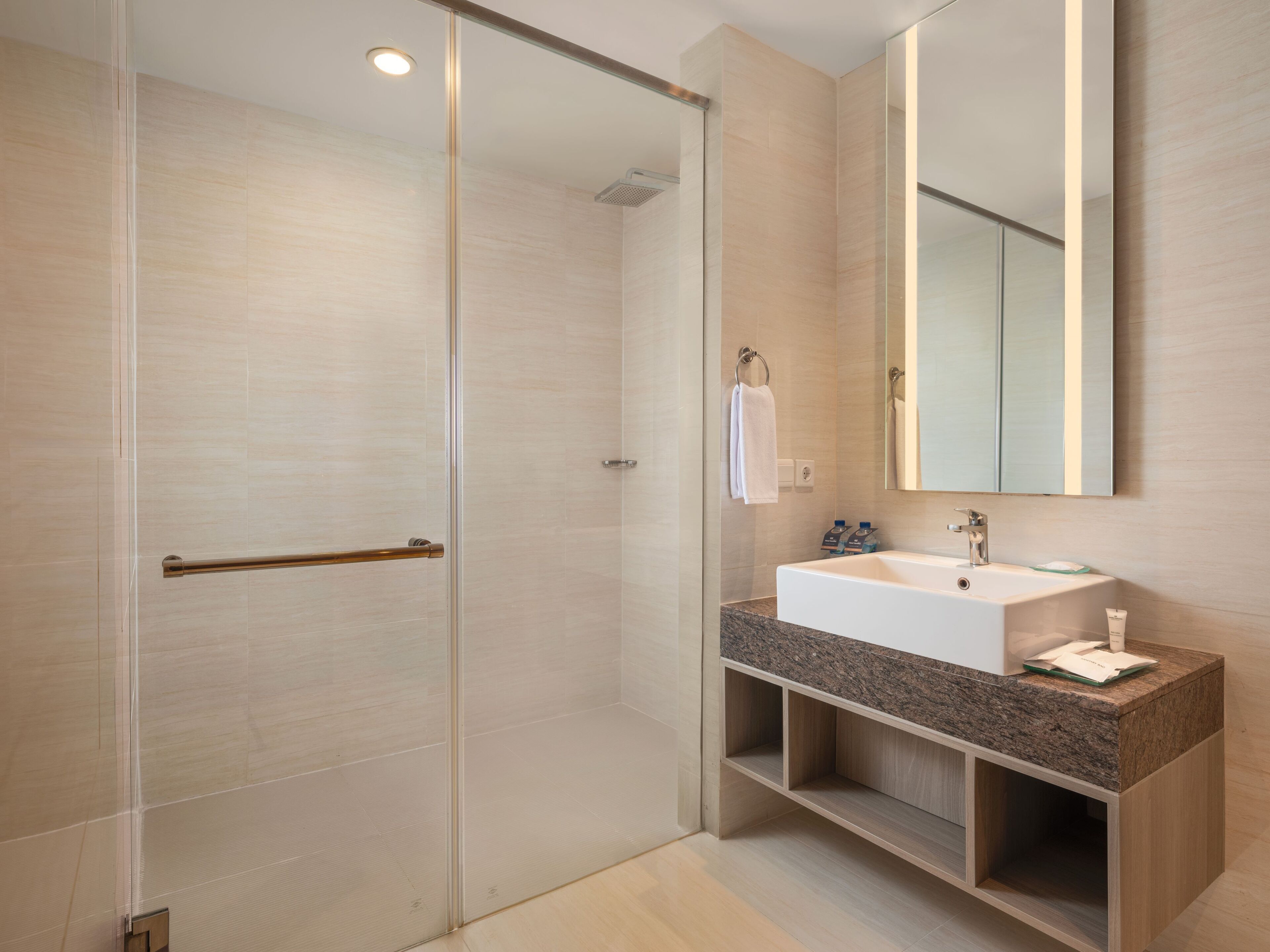 junior suite room | bathroom | shower, free toiletries, hair dryer, slippers