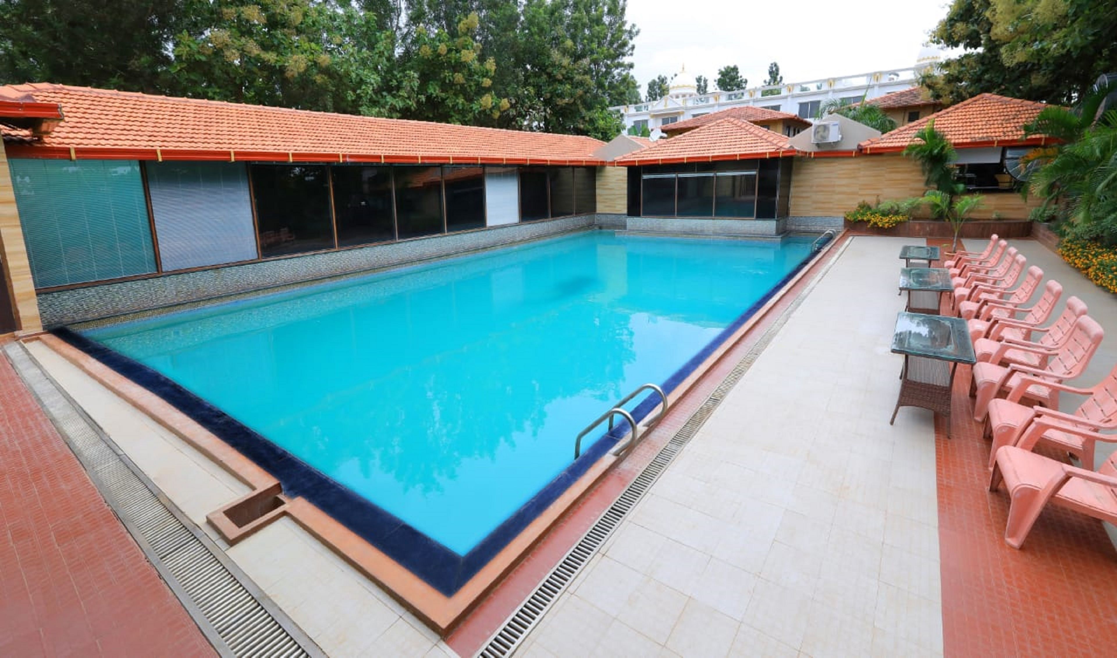 Outdoor pool, open 7:30 AM to 5 PM, free cabanas, pool umbrellas