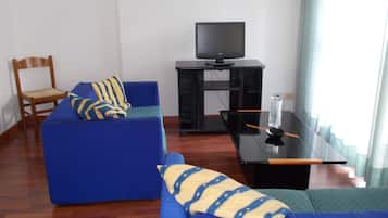 Superior Apartment | Living area | 22-inch flat-screen TV with digital channels, TV