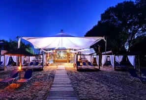 On the beach, beach cabanas, sun-loungers, beach umbrellas