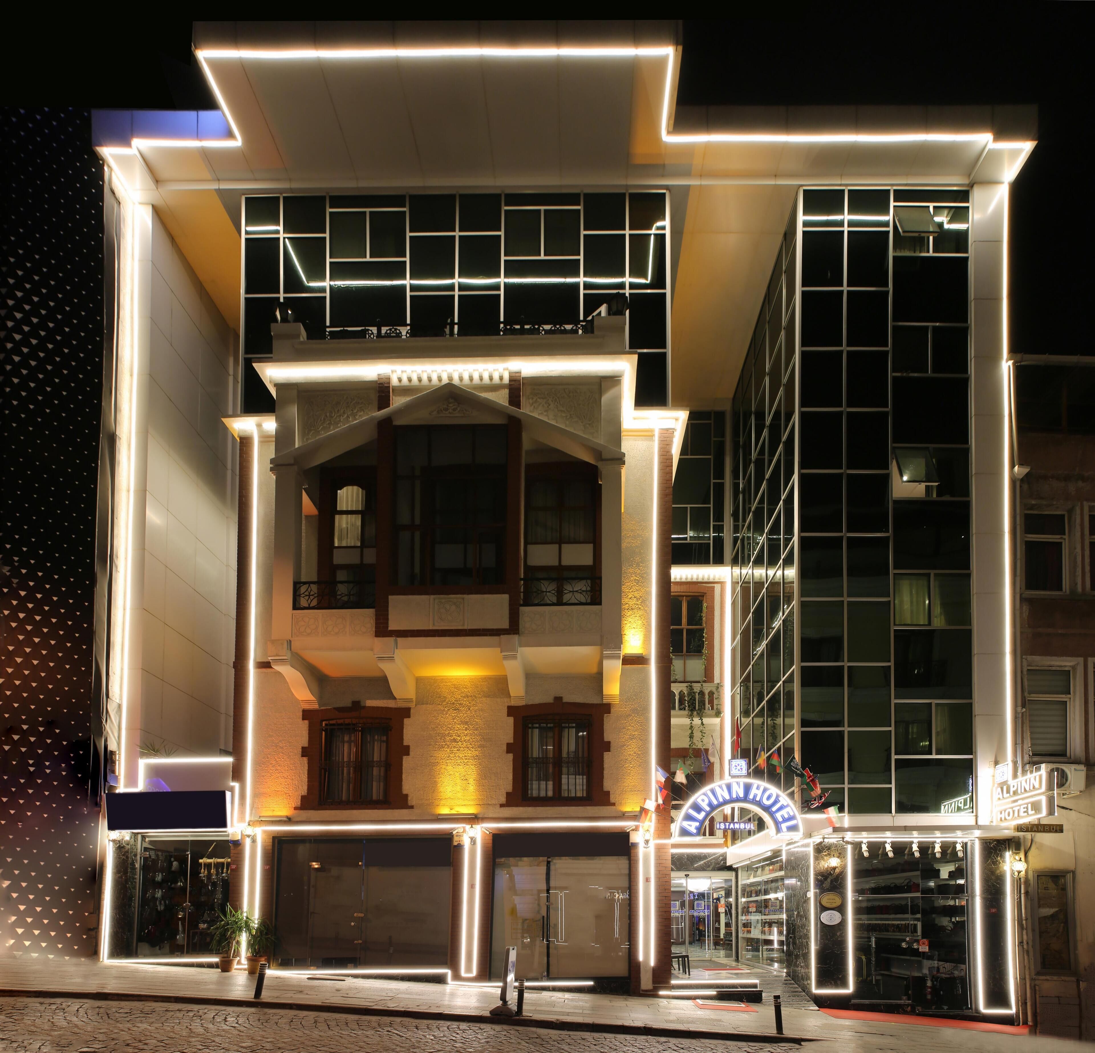 A hotel with a modern facade, large windows, and a prominent entrance.