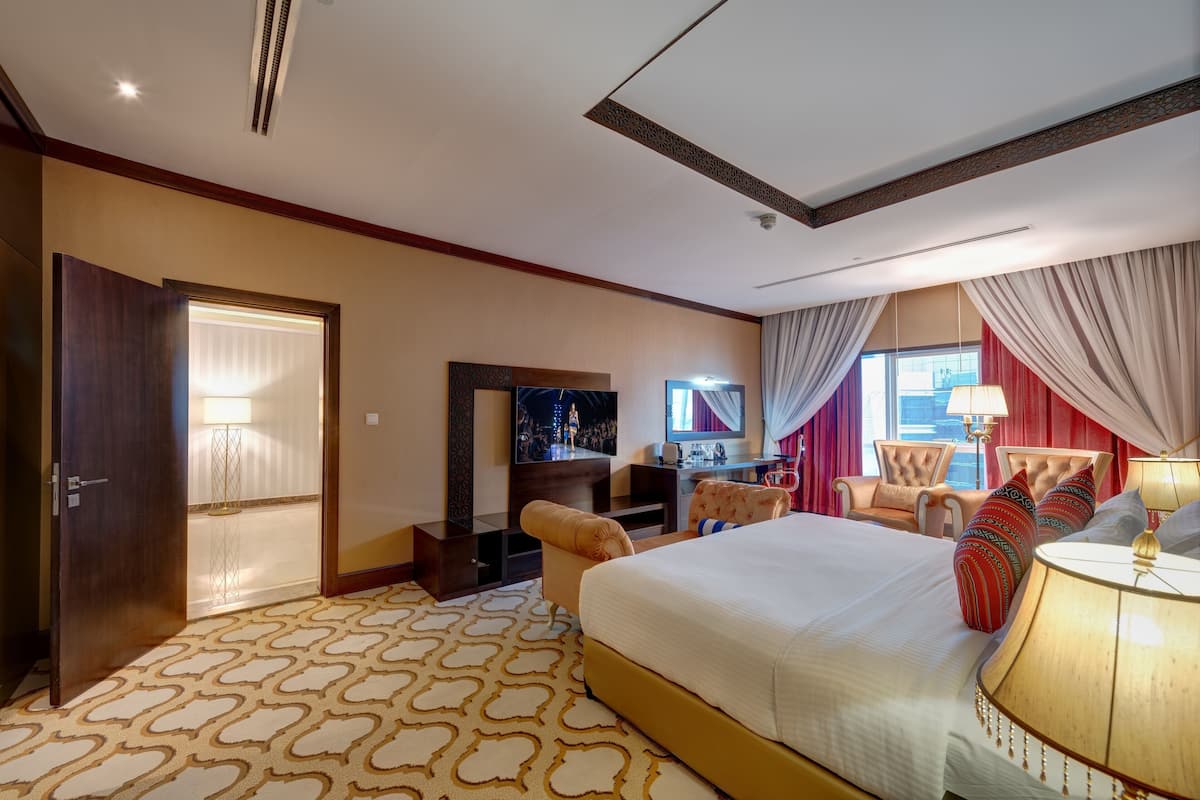 Premium Suite, 1 King Bed | Minibar, in-room safe, individually decorated, individually furnished