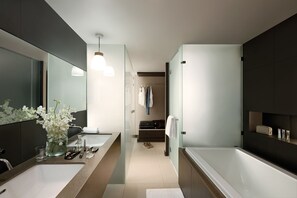 A modern bathroom with a large mirror, two sinks, a bathtub, and a walk-in shower. - Happy 3 (Bangkok)