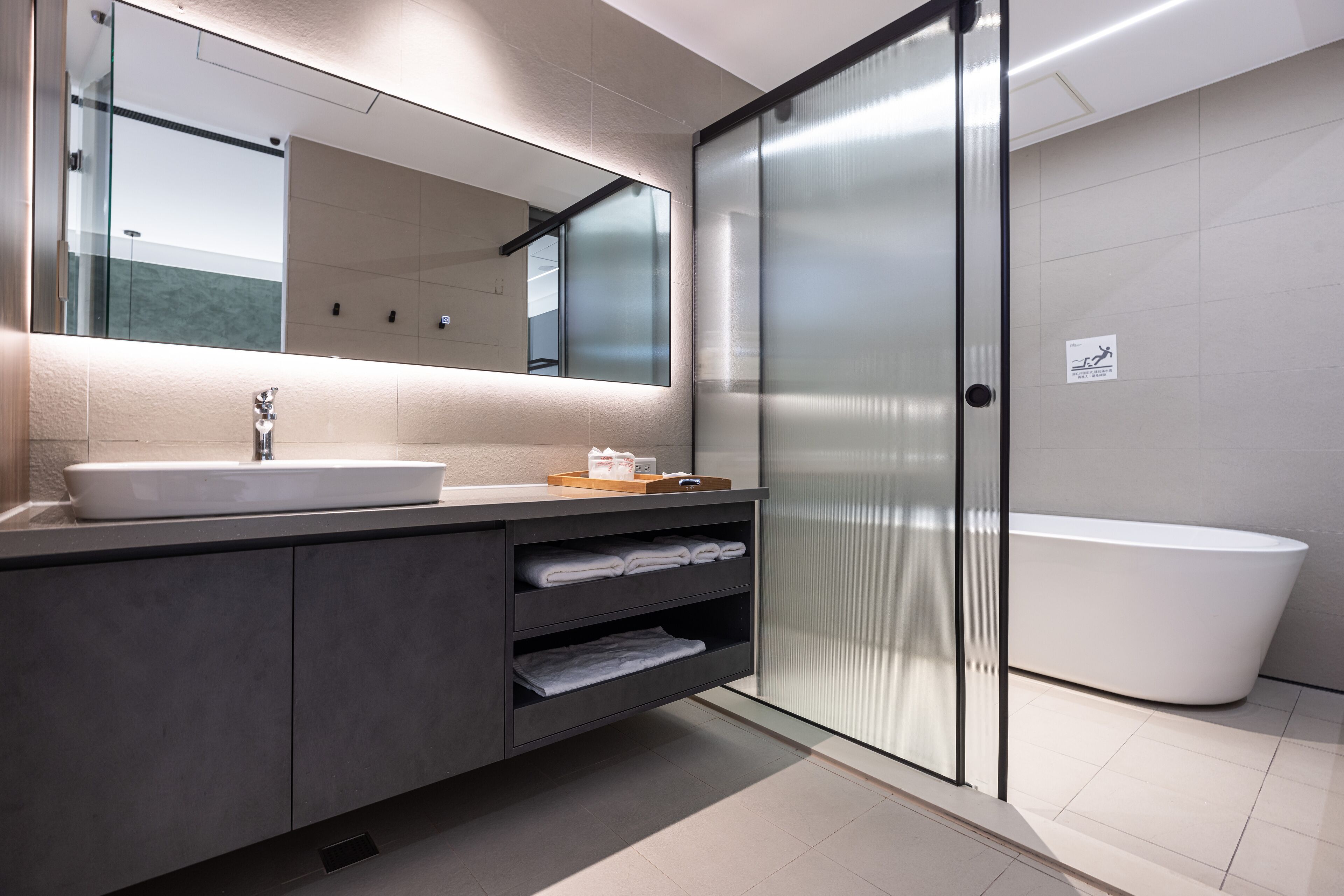 separate bathtub and shower, rainfall showerhead, hair dryer, slippers