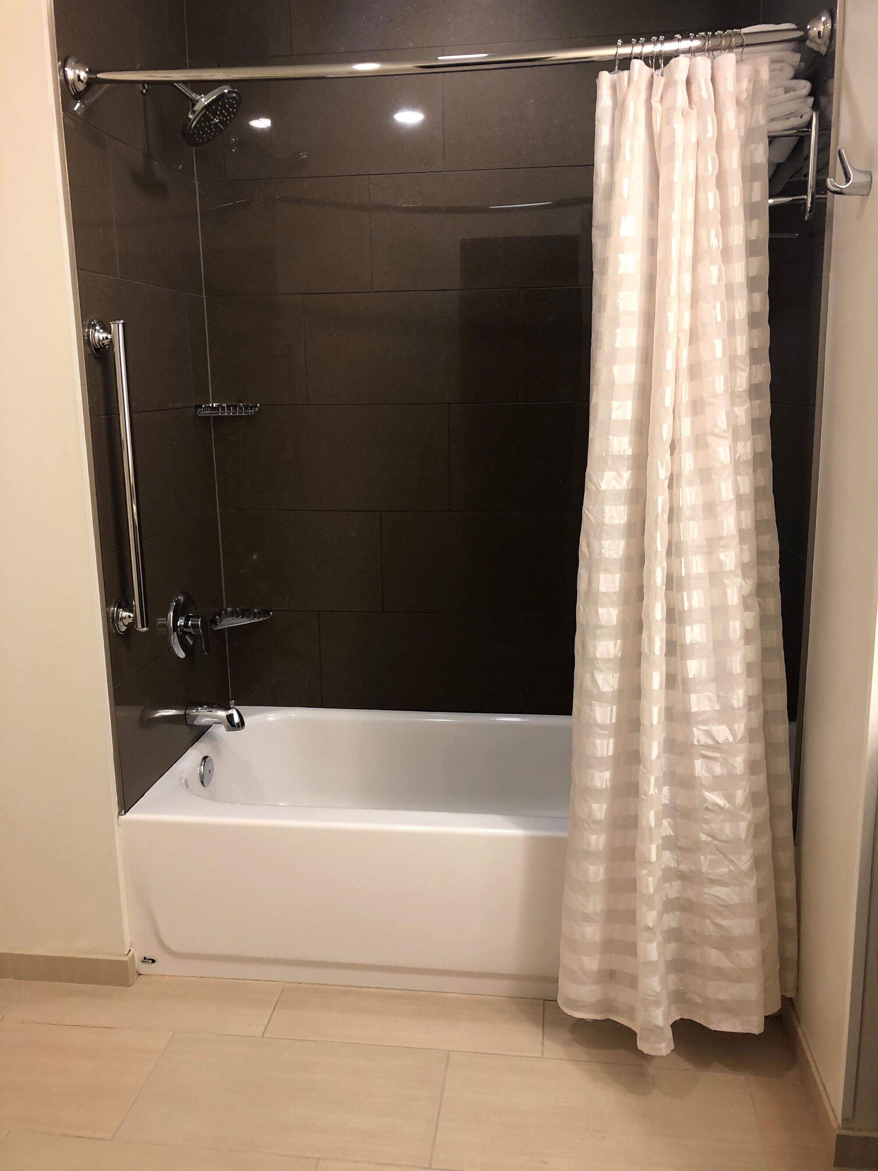 rainfall showerhead, designer toiletries, hair dryer, towels