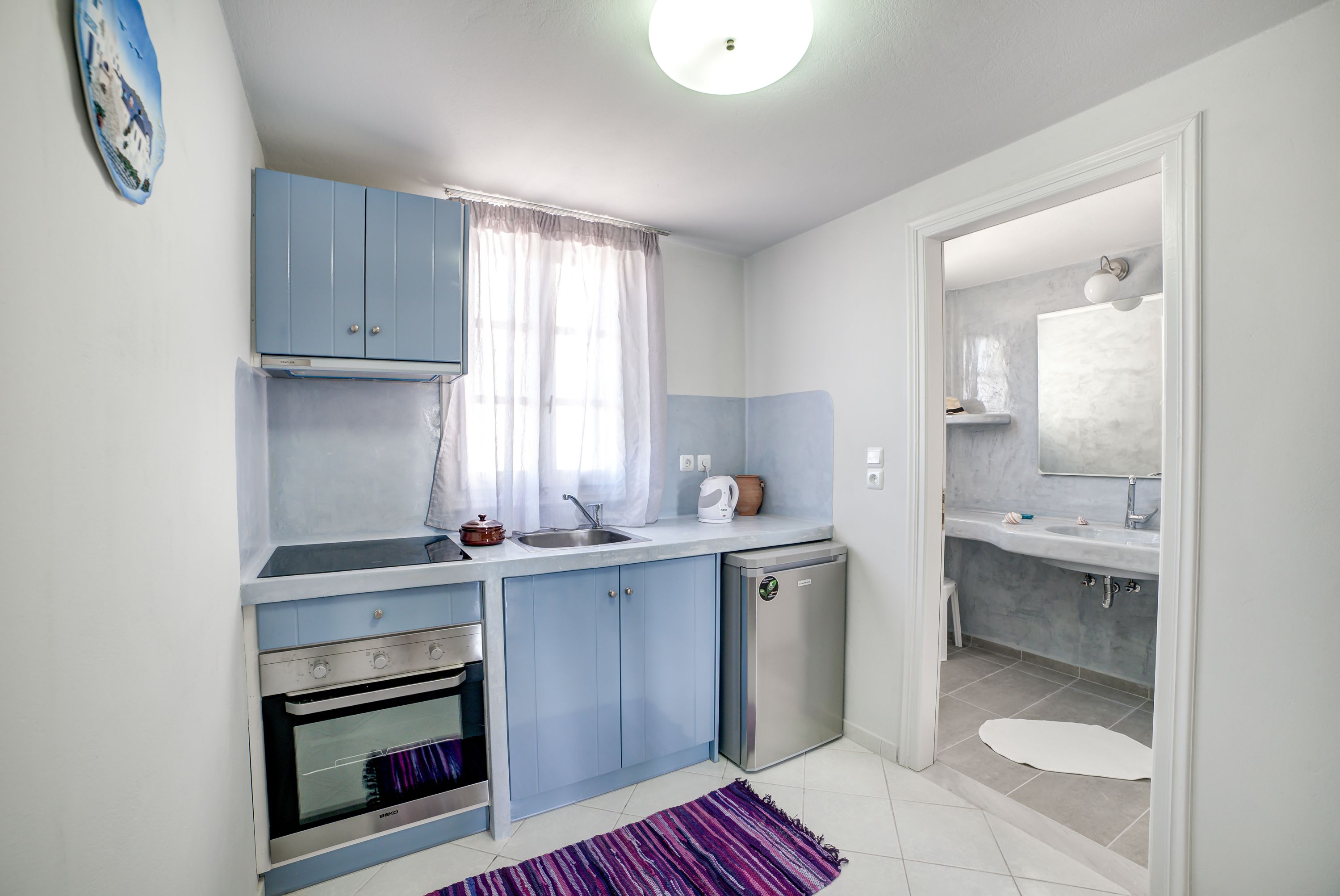 fridge, electric kettle, high chair, cookware/dishes/utensils