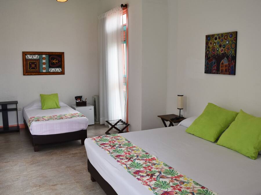 Triple Room | Minibar, in-room safe, individually furnished, free cots/infant beds