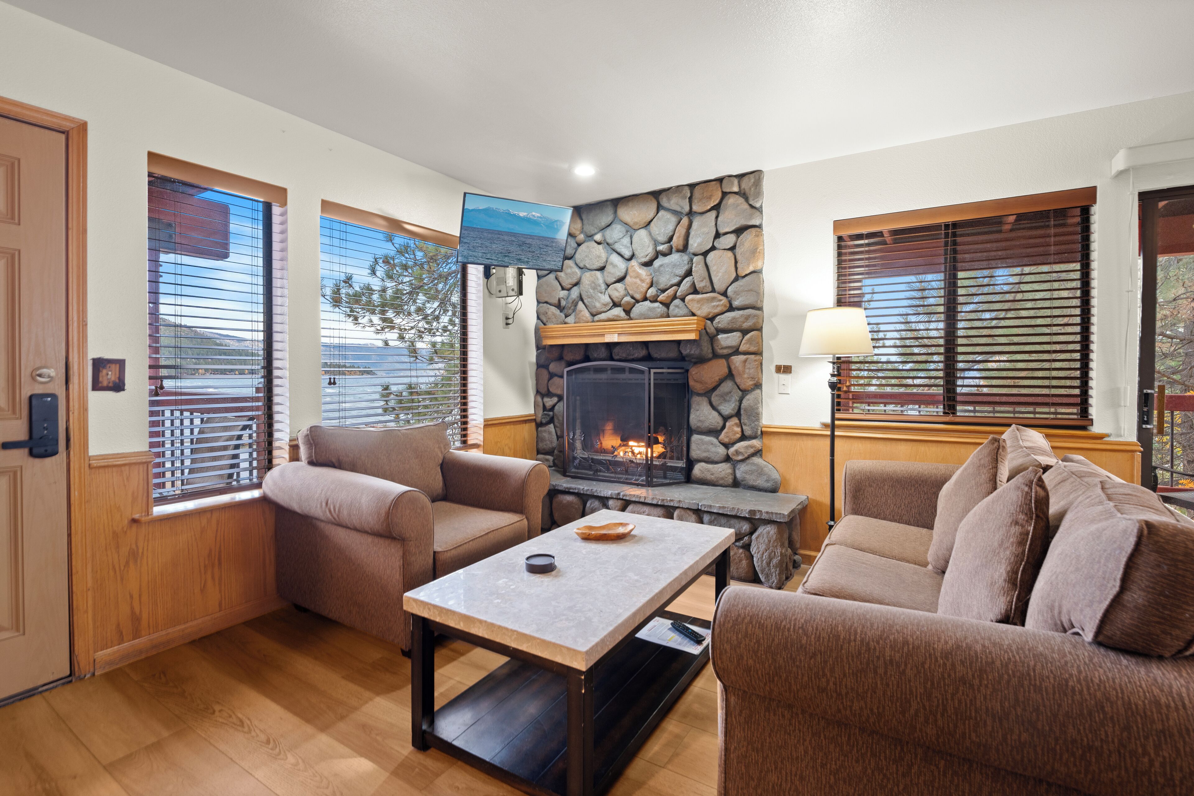 Standard Condo, 1 Queen Bed, Fireplace, Lake View | Living area | 42-inch flat-screen TV with cable channels, fireplace, books