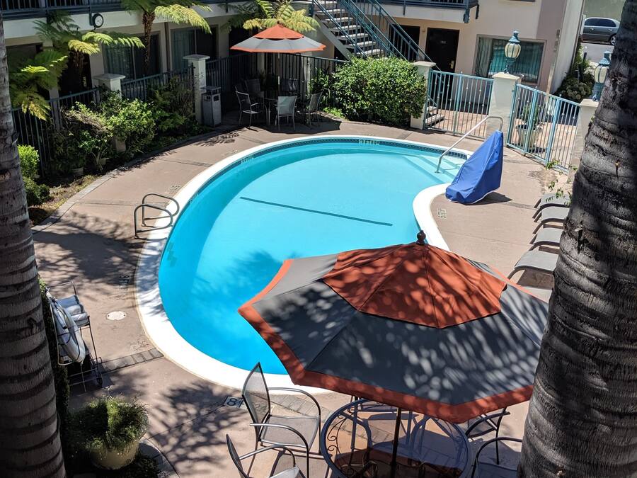 Outdoor pool, open 9:00 AM to 10:00 PM, pool umbrellas, pool loungers