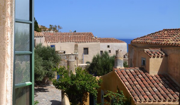 A coastal village with traditional architecture, narrow streets, and a clear view of the sea. - Ritsos Guesthouse (Monemvasia)